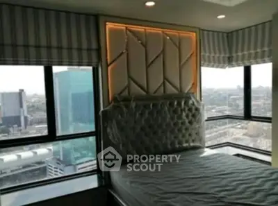 Luxurious bedroom with panoramic city view and elegant decor