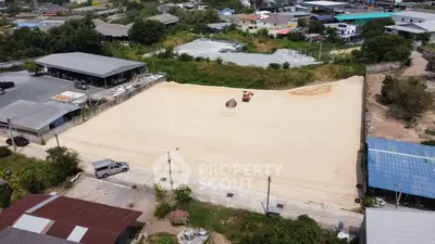 Expansive vacant land plot in a developing neighborhood, ideal for construction or investment opportunities.