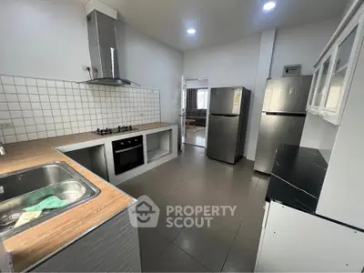 Modern kitchen with stainless steel appliances and open layout