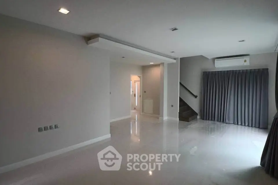 Spacious modern living room with sleek design and natural light