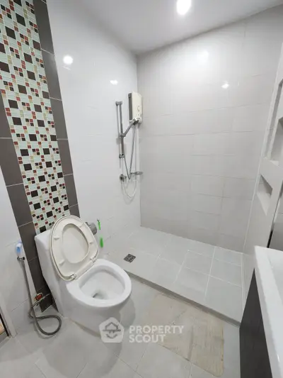 Modern bathroom with sleek tiles and open shower design