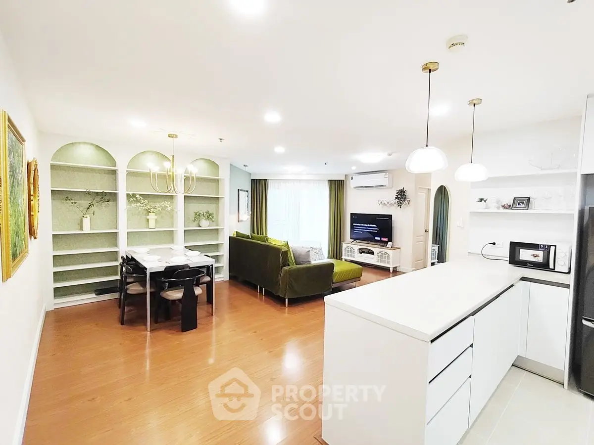 Spacious modern living room with open kitchen and elegant dining area