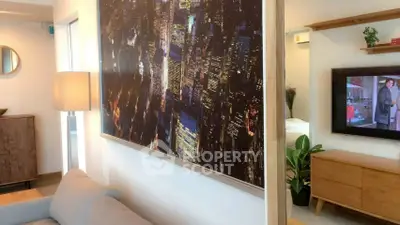 Modern living room with cityscape artwork and cozy furniture setup