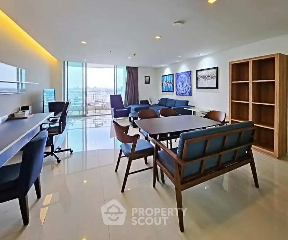 Spacious modern living room with elegant furniture and large windows offering stunning views.