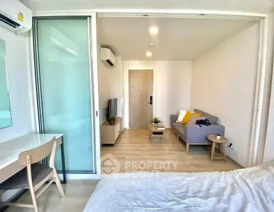Modern studio apartment with open layout and stylish furnishings