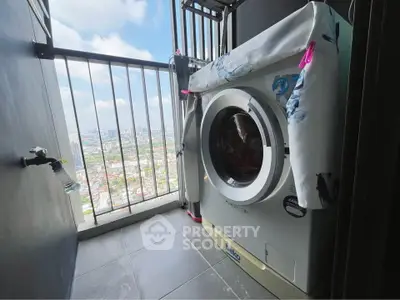 High-rise balcony with washing machine and stunning city view