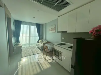 Modern living room with open kitchen and large window view