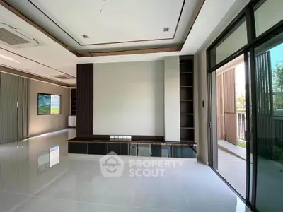 Spacious modern living room with large windows and sleek design