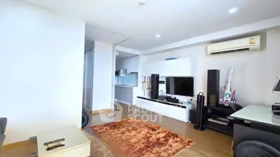 Modern living room with sleek entertainment center and cozy rug