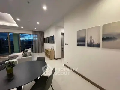 Modern living room with elegant decor and large windows offering stunning views.