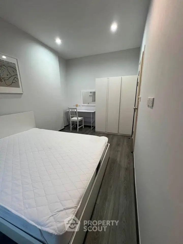 Modern minimalist bedroom with sleek furniture and stylish decor