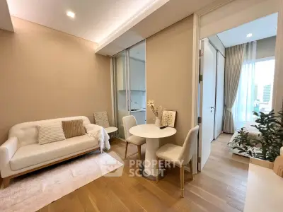 Modern living room with cozy seating and dining area, open to a bright bedroom with city views.