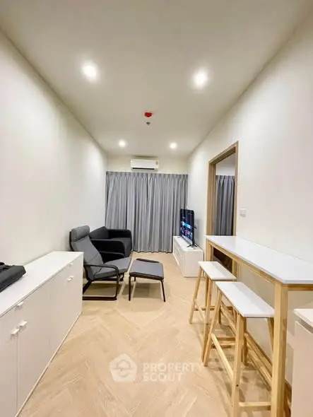 Modern living room with sleek furniture and natural light, perfect for cozy gatherings.