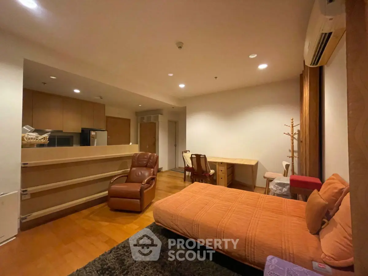 Spacious studio apartment with modern furnishings and open layout