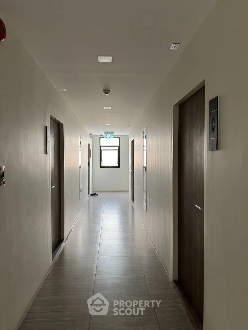 Modern apartment hallway with sleek design and natural lighting