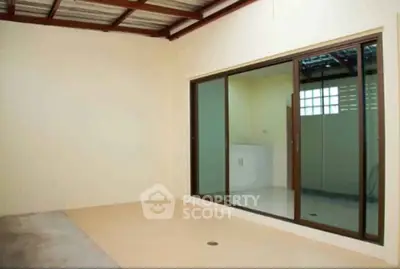 Spacious room with sliding glass doors and modern interior design