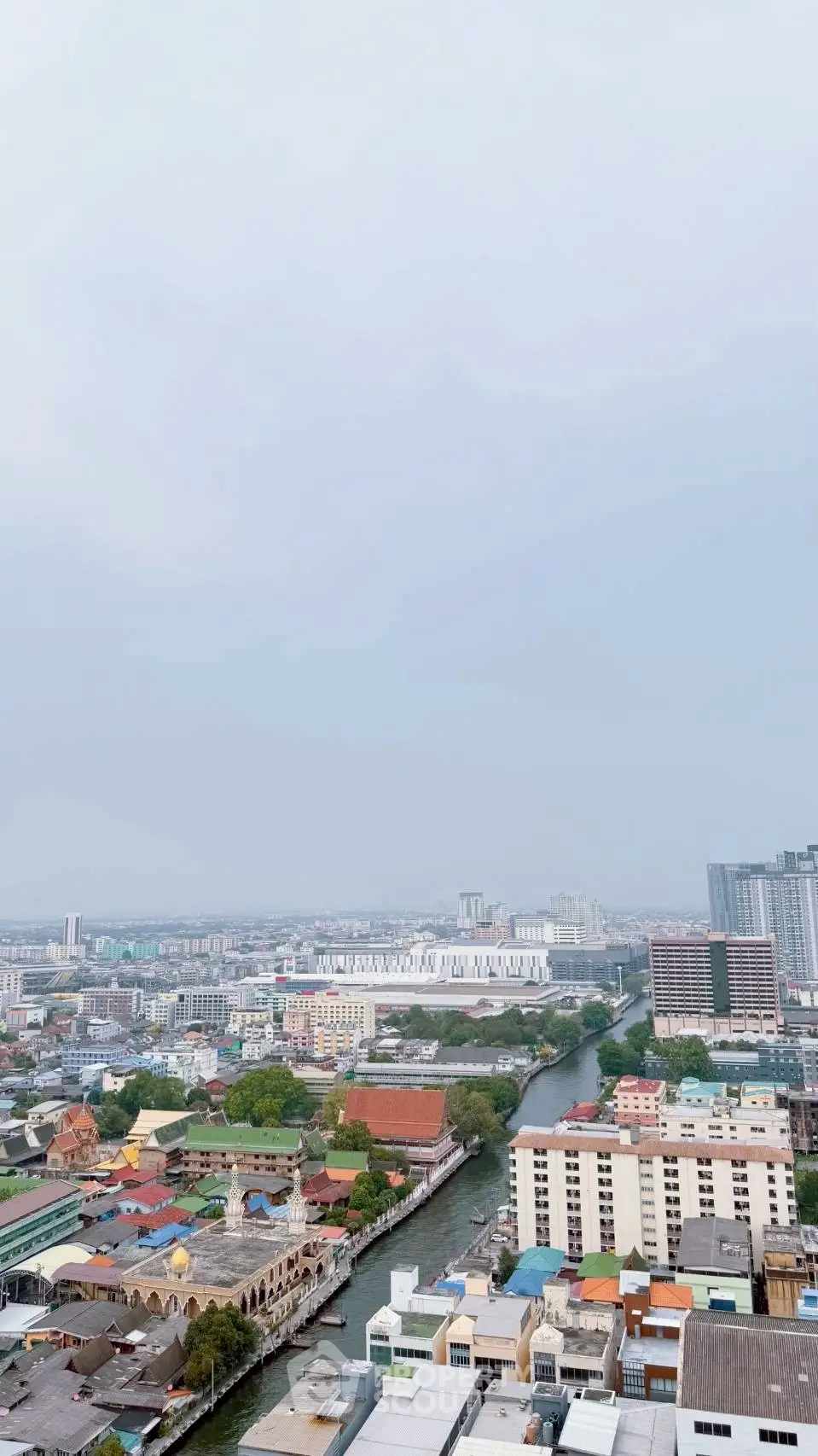 Stunning cityscape view from high-rise building showcasing urban architecture and vibrant skyline.