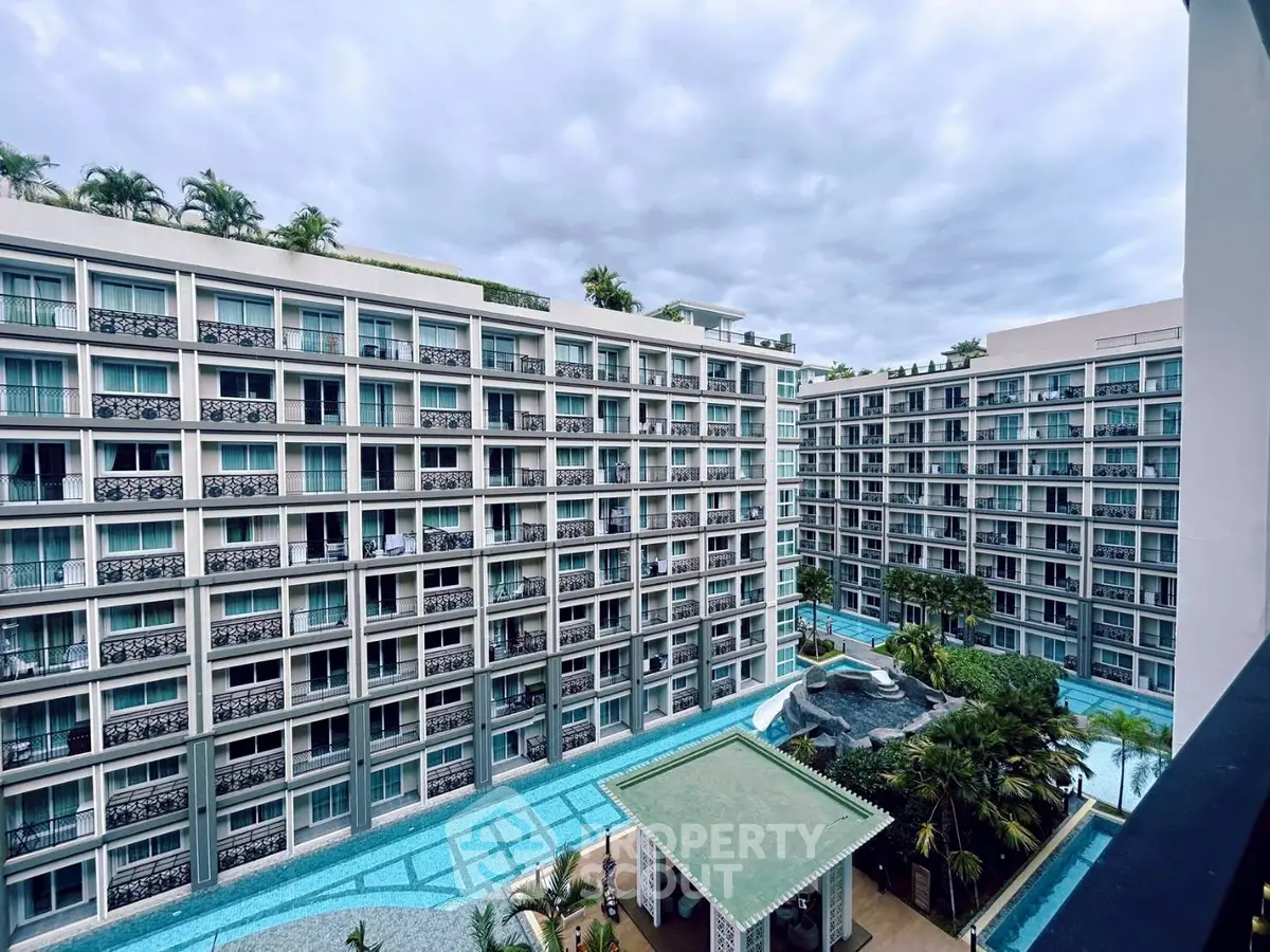 Luxurious apartment complex with stunning pool and modern architecture