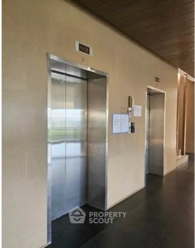 Modern building elevator lobby with sleek design and polished finishes
