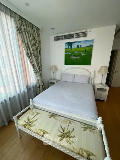 Elegant bedroom with natural light and tasteful decor