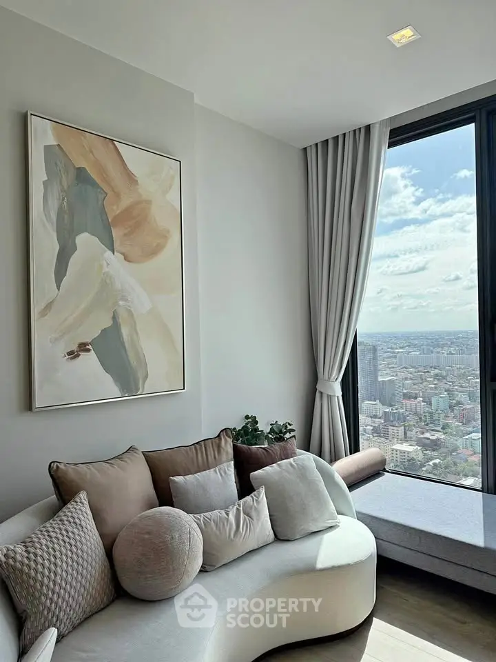 Stylish living room with modern art and panoramic city view