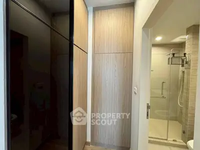 Modern bathroom with sleek shower and wooden cabinetry