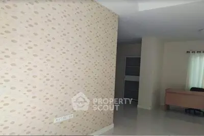 Spacious interior with modern wallpaper and natural light