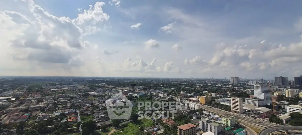 Stunning panoramic cityscape view from high-rise building, showcasing urban skyline and expansive horizon.