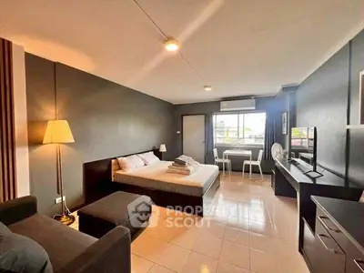 Spacious studio apartment with modern decor and ample natural light