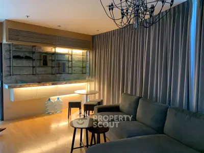 Modern living room with elegant lighting and cozy seating area