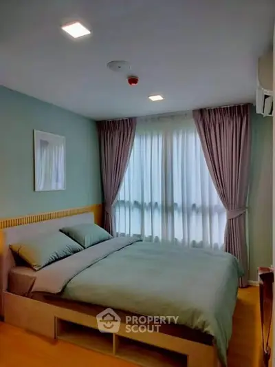 Cozy bedroom with soft lighting and elegant curtains, perfect for relaxation.