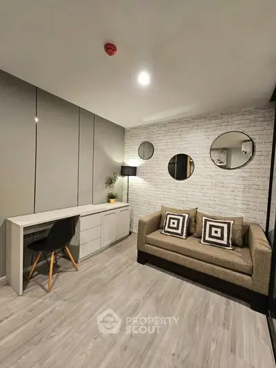 Modern living room with stylish decor and comfortable seating in a contemporary apartment.