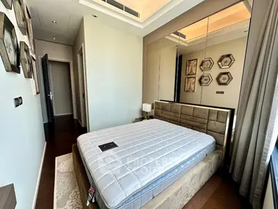 Luxurious bedroom with elegant decor and plush bed in modern apartment