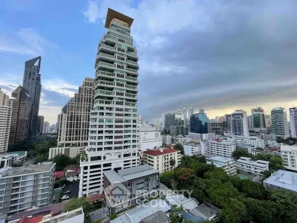Stunning cityscape view with modern high-rise buildings and lush greenery in a vibrant urban setting.