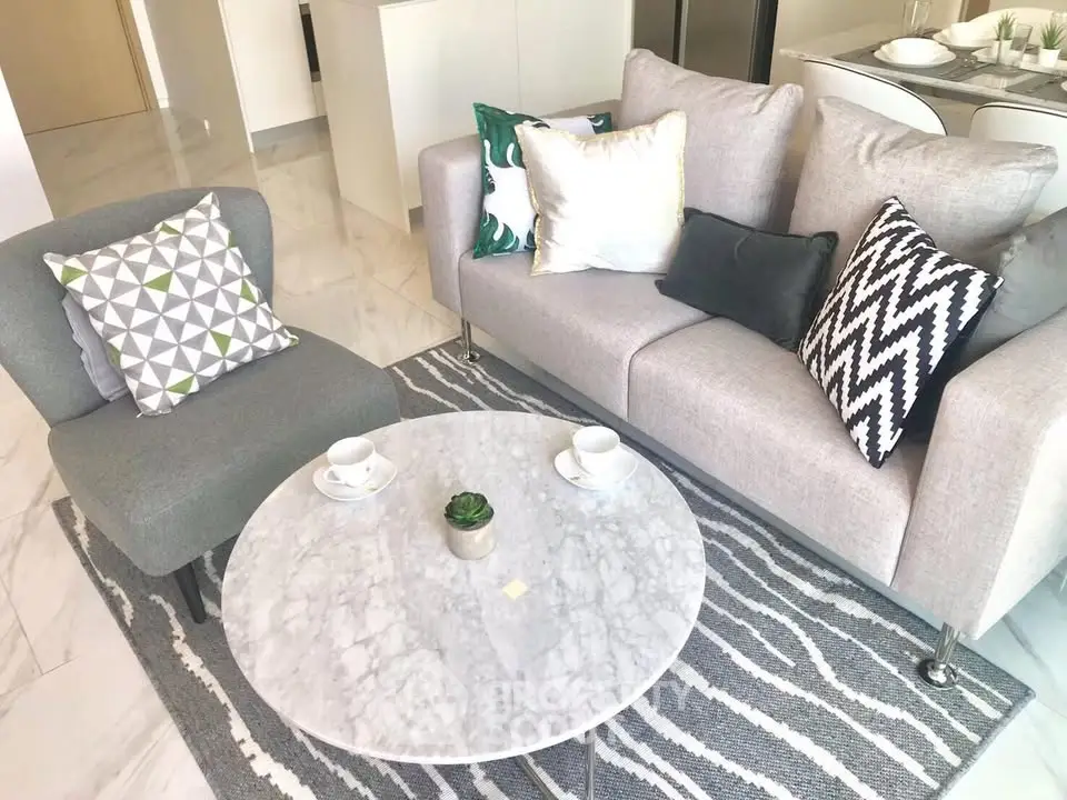 Modern living room with stylish gray sofa and chic marble coffee table