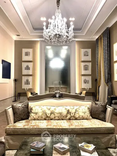 Luxurious living room with elegant chandelier and plush seating, perfect for sophisticated gatherings.