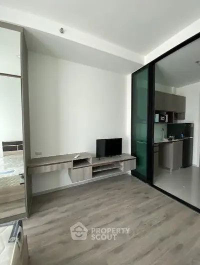 Modern apartment interior with open layout and sleek kitchen design