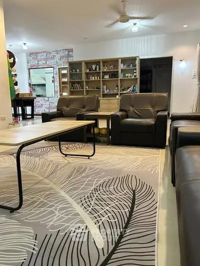 Spacious living room with modern decor and stylish furniture