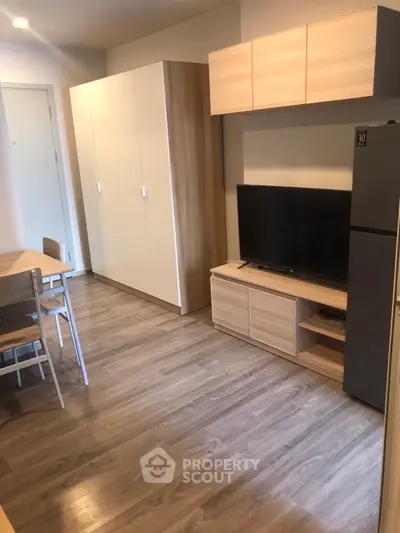 Modern living room with sleek furniture and wooden flooring