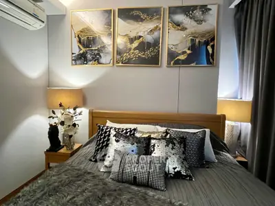 Luxurious bedroom with elegant decor and stylish artwork