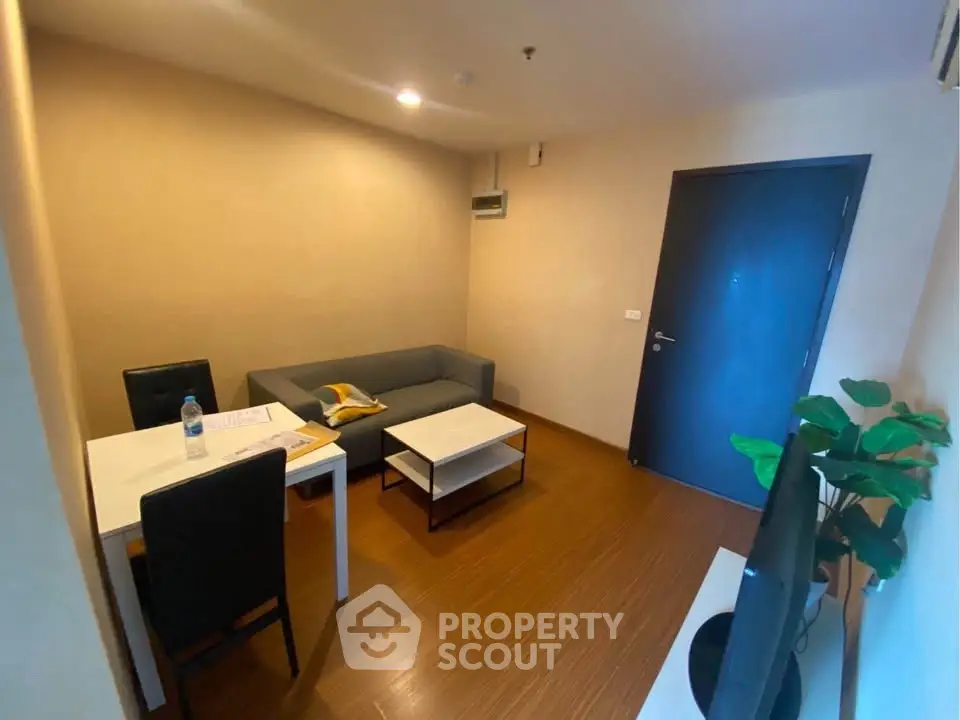 Cozy living room with modern furniture and warm lighting, perfect for relaxation and entertainment.