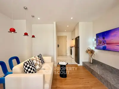 Modern living room with stylish decor and open kitchen layout