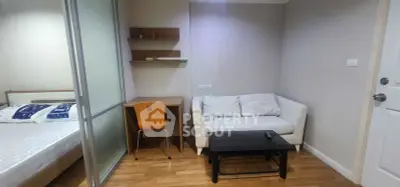 Cozy studio apartment with modern furnishings and wooden flooring