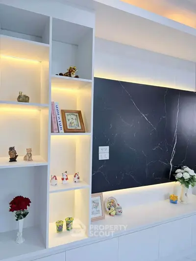 Modern living room with elegant shelving and ambient lighting