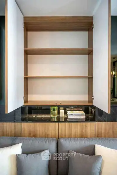 Modern living room with open wooden cabinet and stylish decor