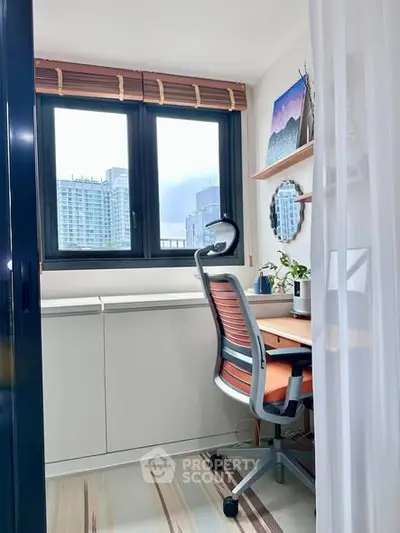 Bright study room with modern chair and desk, large window view of cityscape, ideal for productivity.