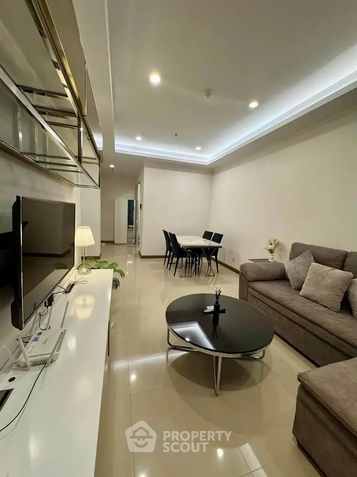 Modern living room with sleek furniture and ambient lighting in a stylish apartment.