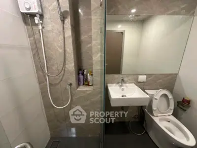 Modern bathroom with glass shower and sleek fixtures
