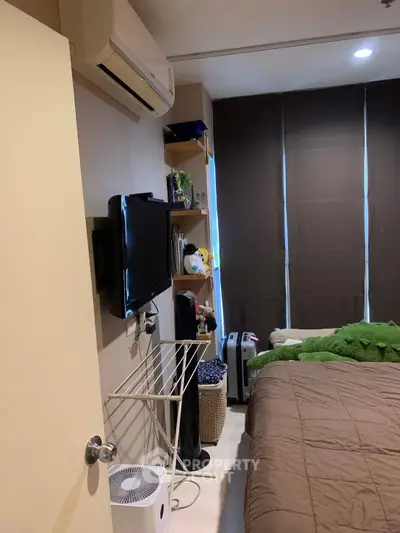 Cozy bedroom with modern amenities and stylish decor