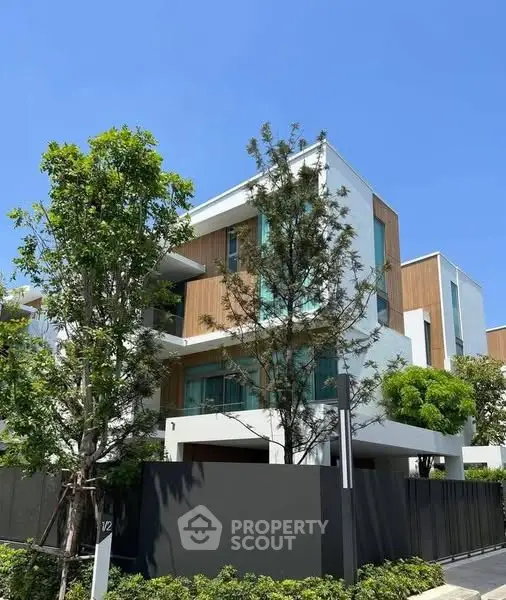 Modern luxury villa with sleek design and lush greenery in a prime location.